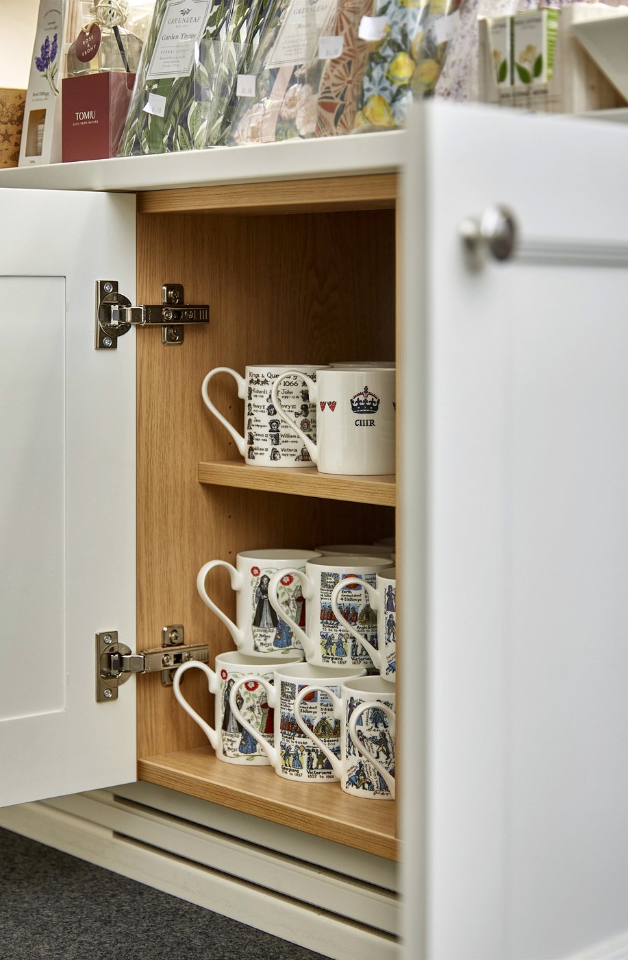 An open shop cabinet showing its oak-lined interior
