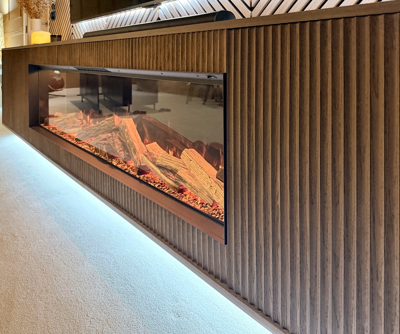 Close view of the fluted timber front and the inset fire
