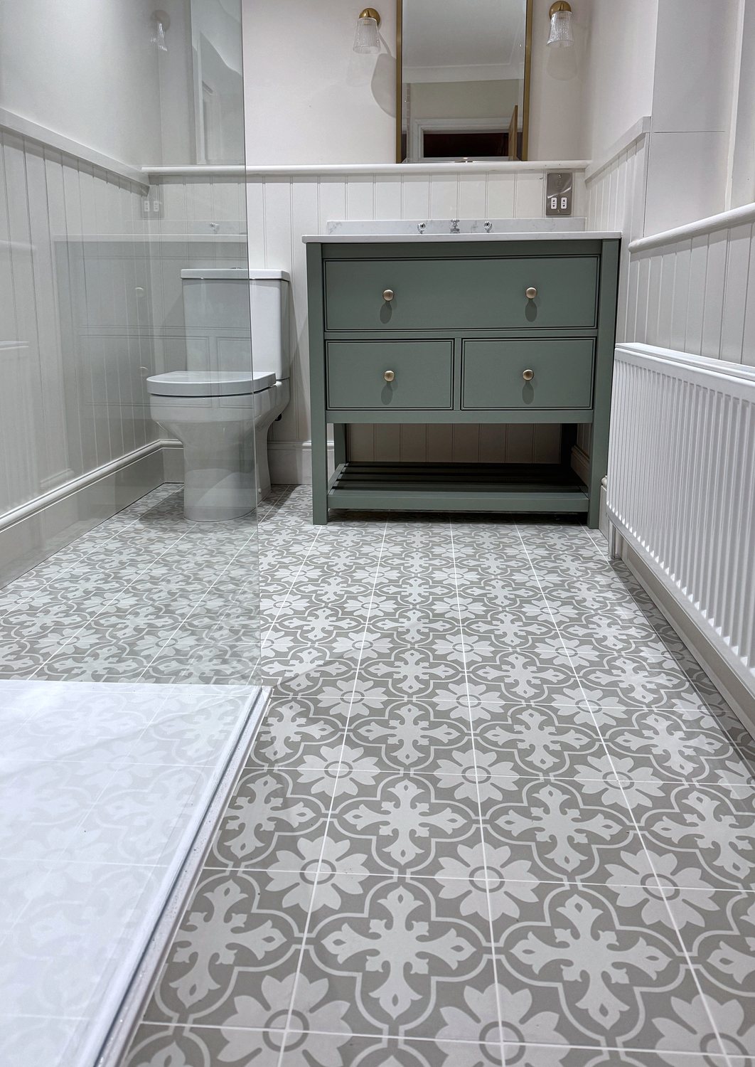 Sage-green washstand with two drawers and an open shelf below