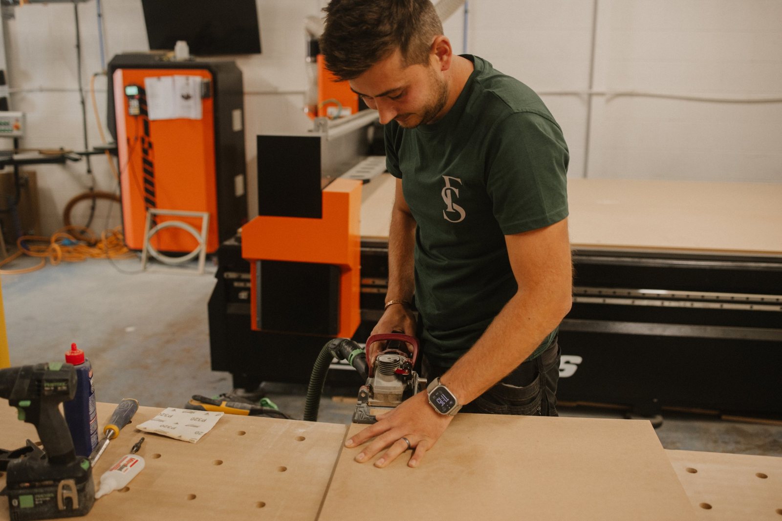 Cutting joints into a panel at the workbench in the Forest & Stone workshop
